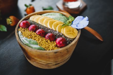 Delicious dessert with fruits and juice on table